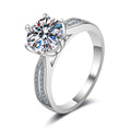 Round Moissanite Side Stone Ring with CZ in rhodium-plated S925 sterling silver on clean white background