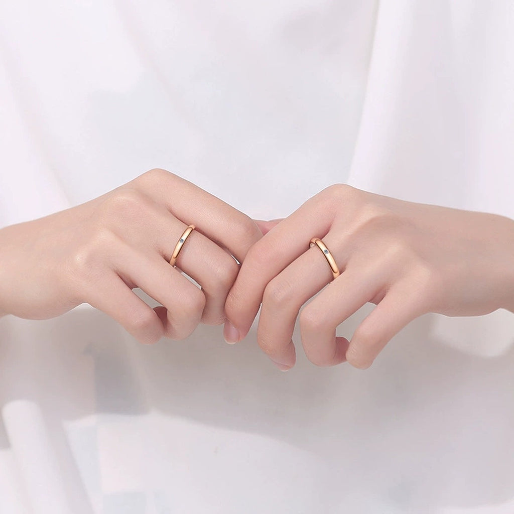 Couples Moissanite Band Ring Set worn on hand to show scale, band width, and ring profile