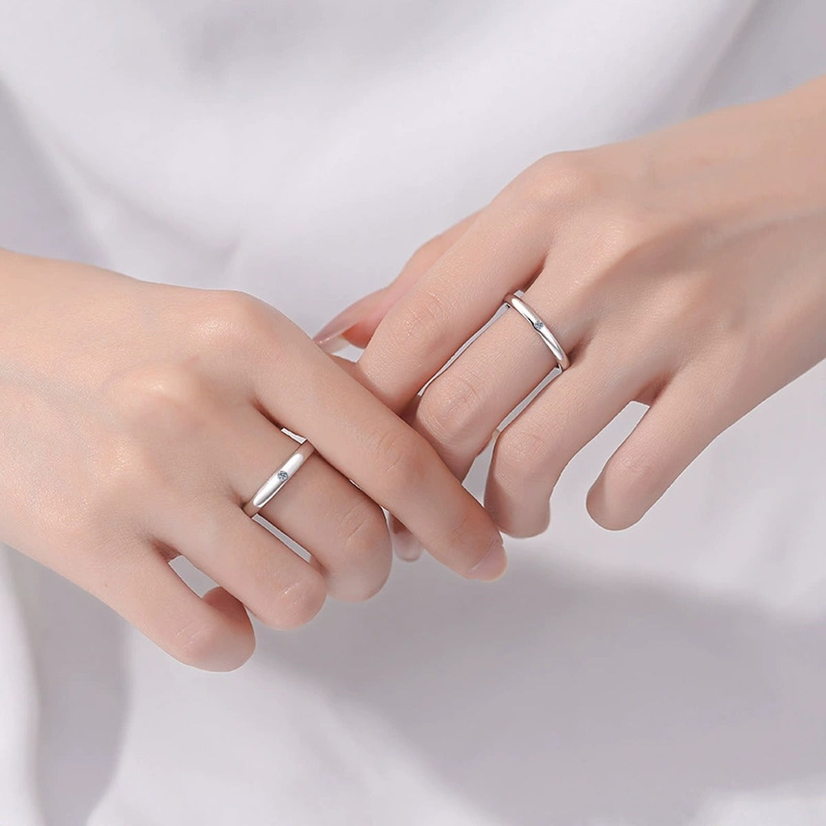 Couples Moissanite Band Ring Set worn on hand to show scale, band width, and ring profile
