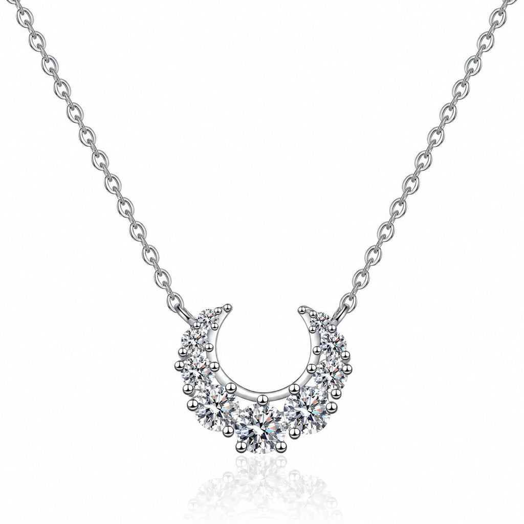 Crescent Moissanite Necklace in Rhodium-Plated S925 sterling silver white background product photo showing crescent moon necklace with graduated round moissanite stones