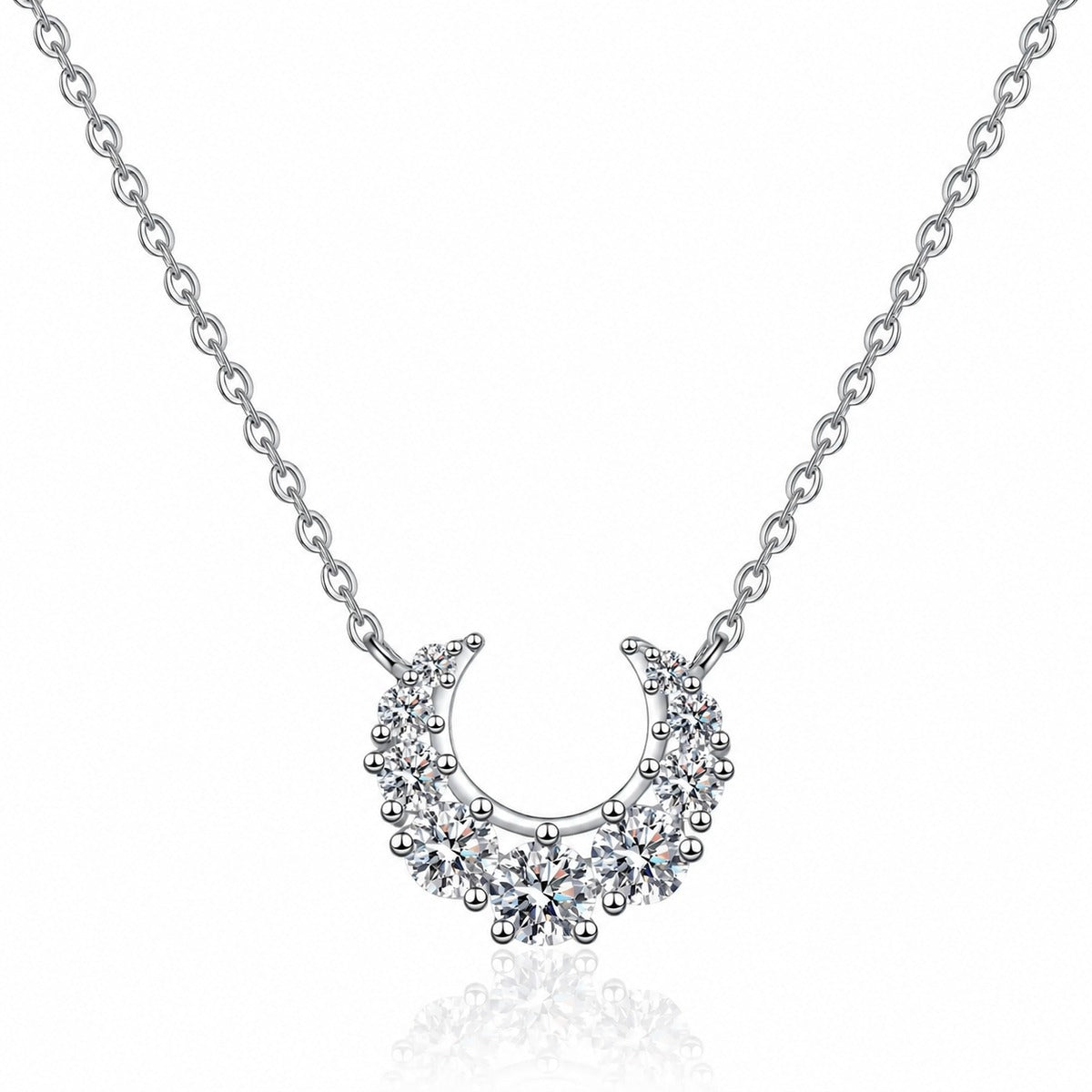 Crescent Moissanite Necklace in Rhodium-Plated S925 sterling silver white background product photo showing crescent moon necklace with graduated round moissanite stones