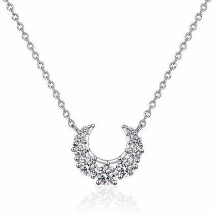 Crescent Moissanite Necklace in Rhodium-Plated S925 sterling silver white background product photo showing crescent moon necklace with graduated round moissanite stones