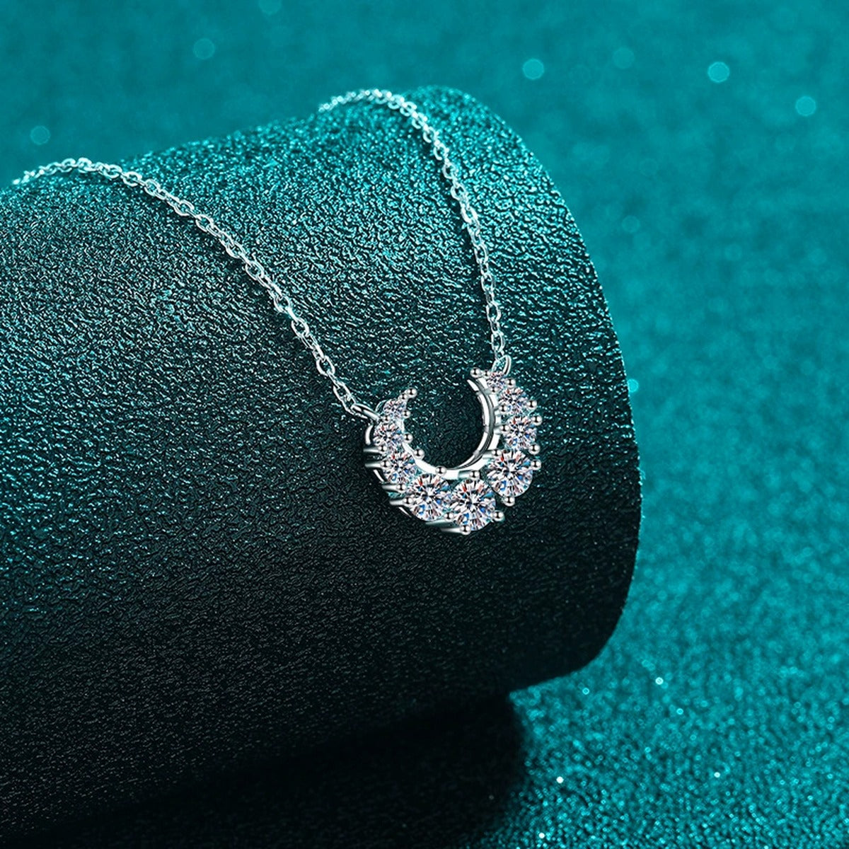 Crescent Moissanite Necklace in Rhodium-Plated S925 sterling silver close-up product scene showing pendant setting