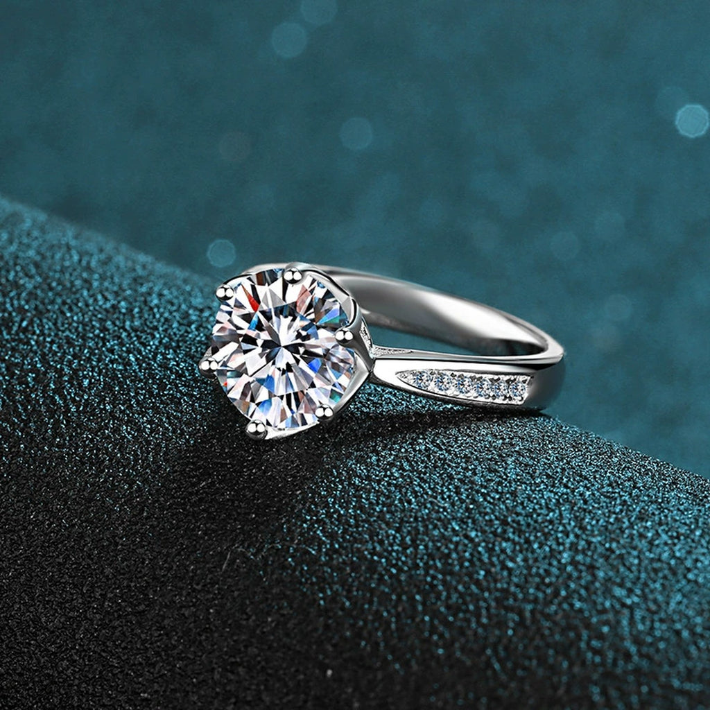 Round Moissanite Solitaire Engagement Ring with CZ product view showing moissanite setting and metal finish