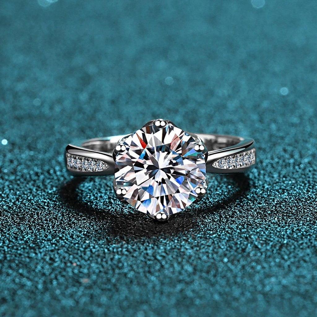 Round Moissanite Solitaire Engagement Ring with CZ product view showing moissanite setting and metal finish