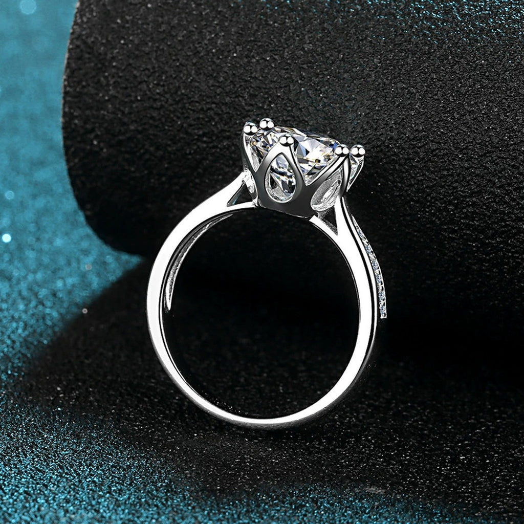 Round Moissanite Solitaire Engagement Ring with CZ product view showing moissanite setting and metal finish