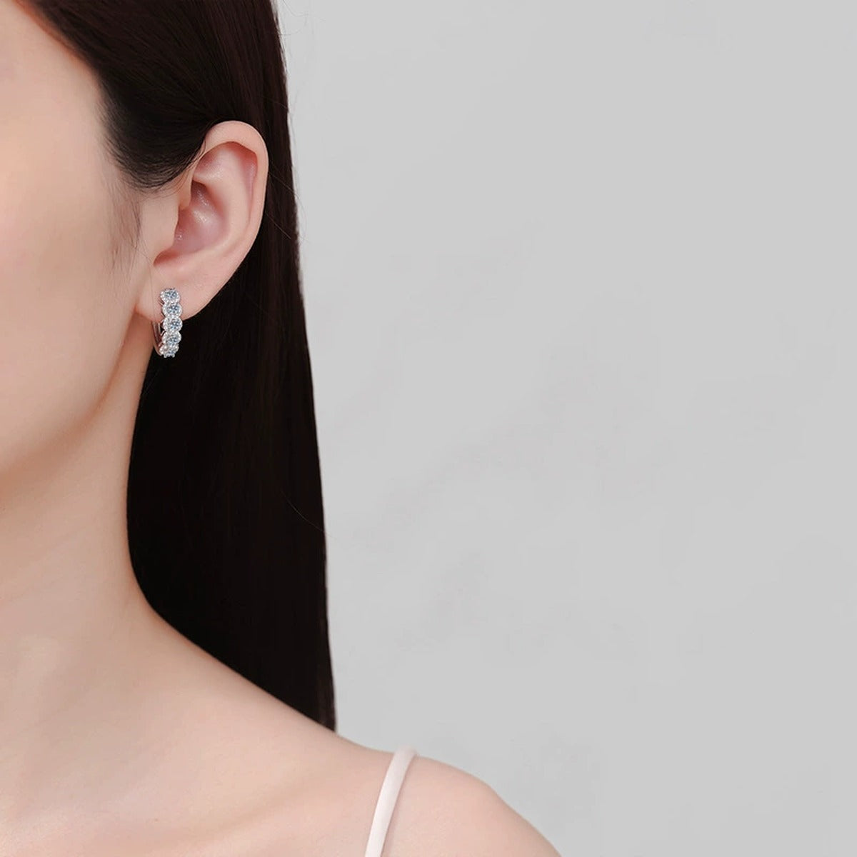 Round Moissanite Hoop Earrings with CZ in Rhodium-Plated S925 sterling silver worn on ear by model showing scale, placement, and hoop earrings styling