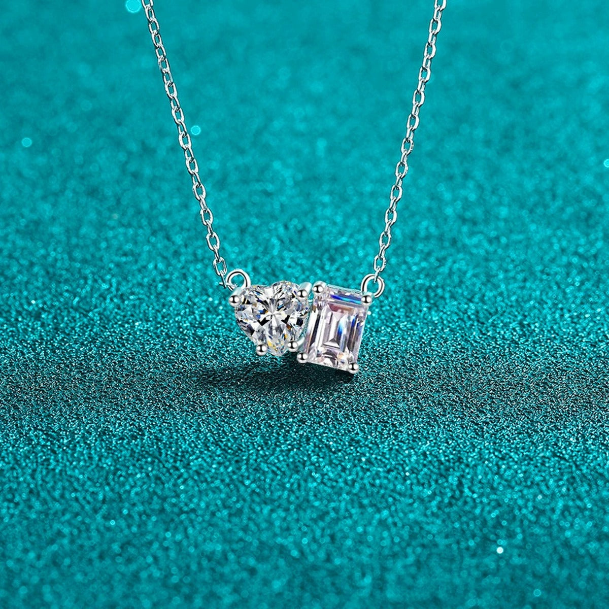 Heart and Rectangular Moissanite Pendant Necklace in Rhodium-Plated S925 sterling silver blue display scene showing chain and stone layout