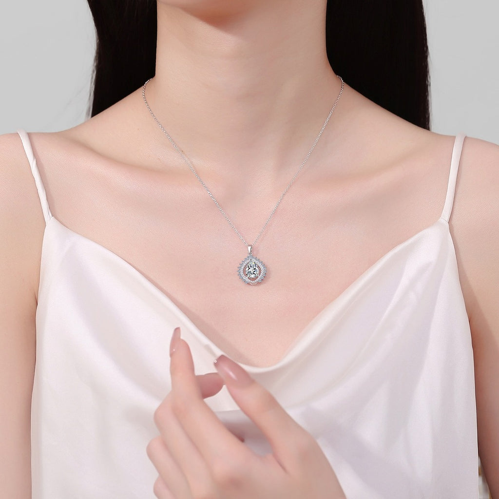 Sunburst Pear Cut Moissanite Pendant Necklace with CZ in Rhodium-Plated S925 sterling silver neckline model view showing pendant scale and adjustable chain