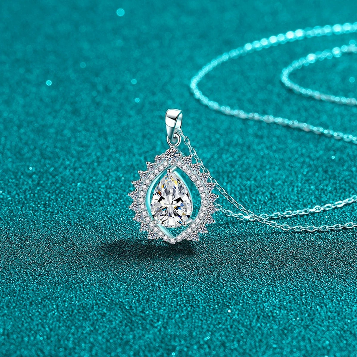 Sunburst Pear Cut Moissanite Pendant Necklace with CZ in Rhodium-Plated S925 sterling silver close-up product scene showing pendant setting