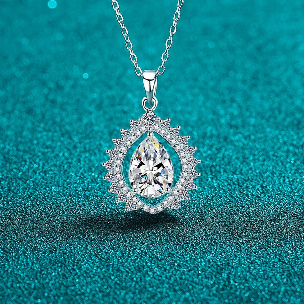Sunburst Pear Cut Moissanite Pendant Necklace with CZ in Rhodium-Plated S925 sterling silver blue display scene showing chain and stone layout