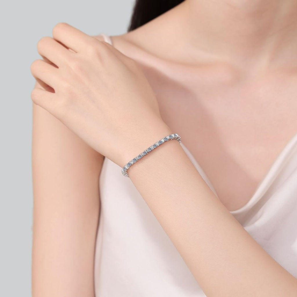 Classic Round Moissanite Tennis Bracelet in Rhodium-Plated S925 sterling silver worn on wrist model view showing scale and adjustable fit