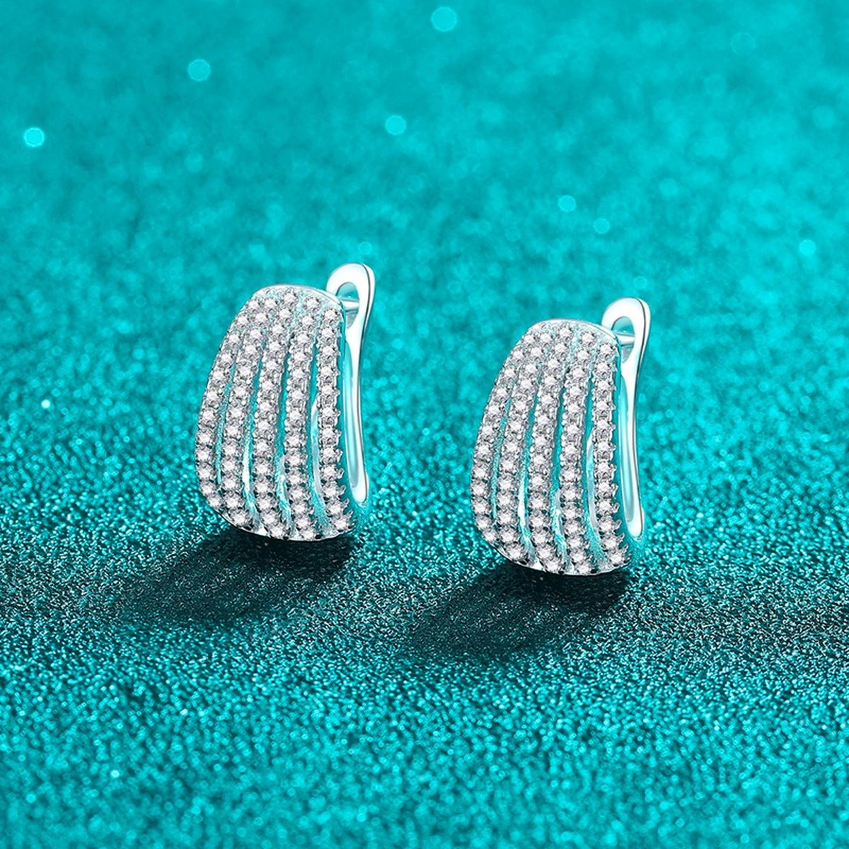Pave Moissanite Huggie Hoop Earrings in Rhodium-Plated S925 sterling silver product scene view showing angled setting detail
