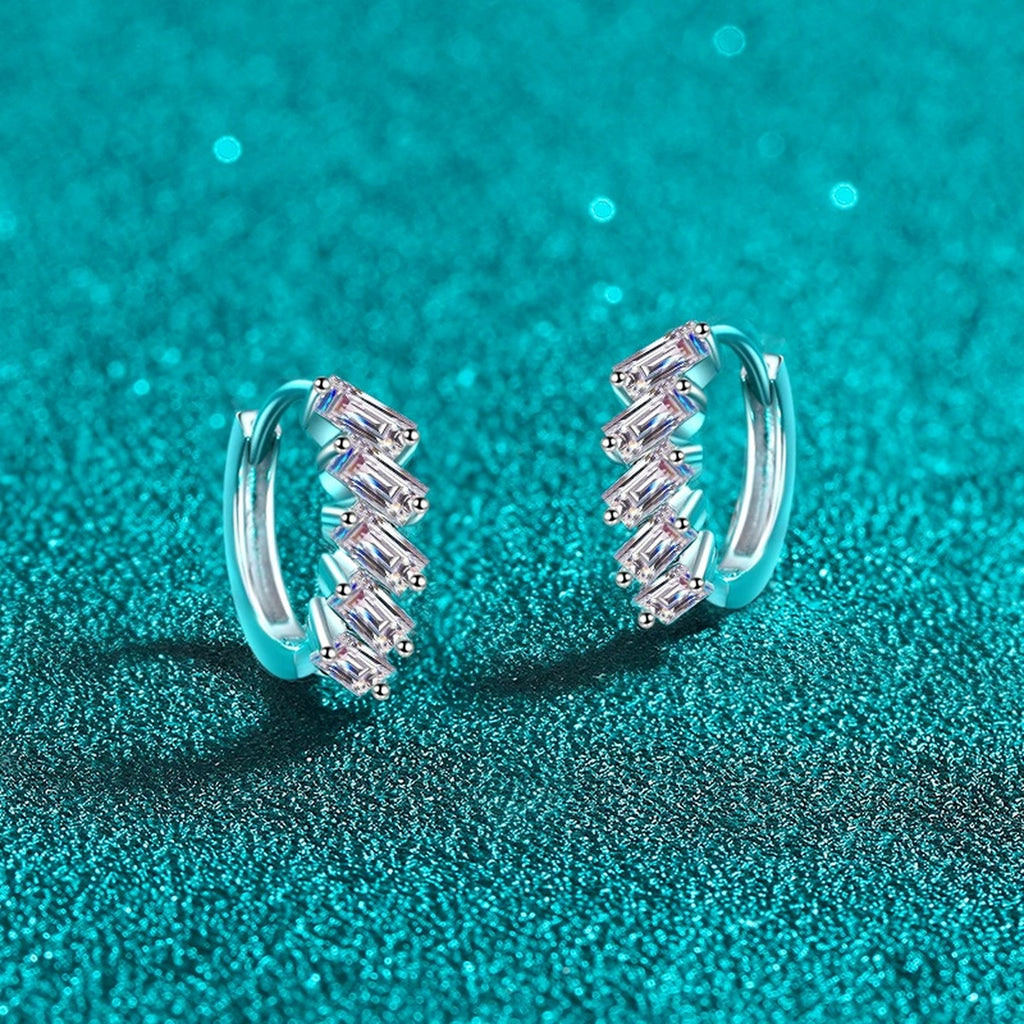 Emerald Cut Moissanite Huggie Hoop Earrings in Rhodium-Plated S925 sterling silver product scene view showing angled setting detail