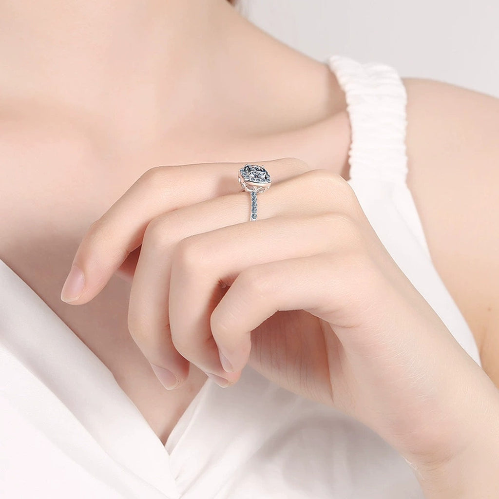 Cushion Halo Moissanite Ring with CZ in Rhodium-Plated S925 Sterling Silver worn on hand, showing scale, finger coverage, and rhodium-plated finish