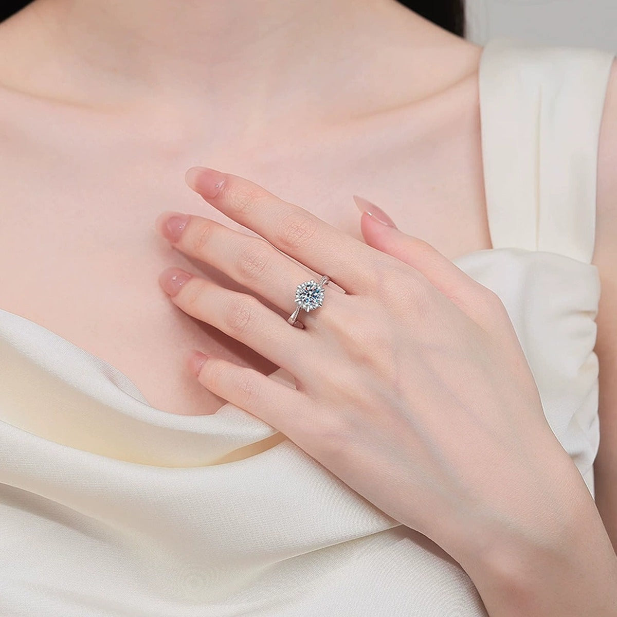Round Moissanite Ring with CZ worn on hand to show scale, band width, and ring profile