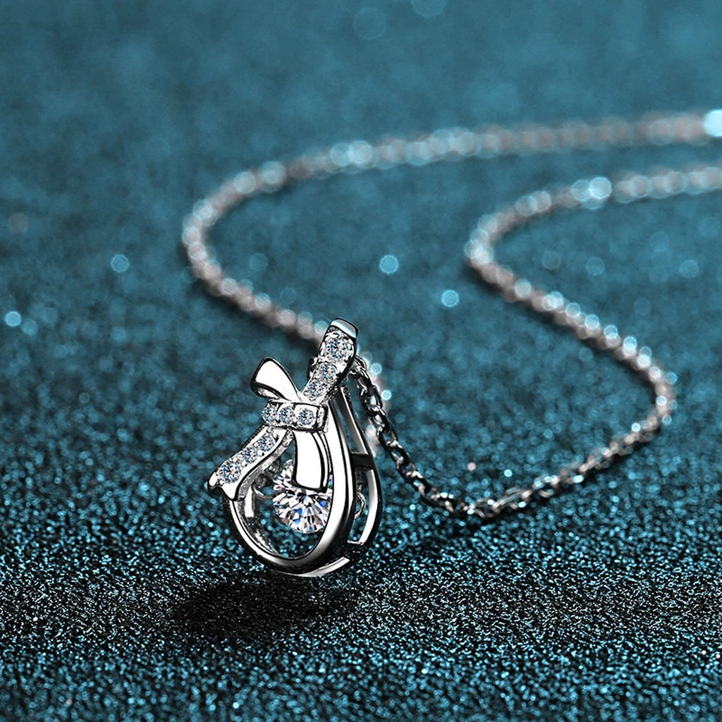 Ribbon Bow Moissanite Pendant Necklace with CZ in Rhodium-Plated S925 sterling silver product scene view showing angled sparkle