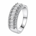 Emerald and Round Moissanite Statement Ring in rhodium-plated S925 sterling silver on clean white background