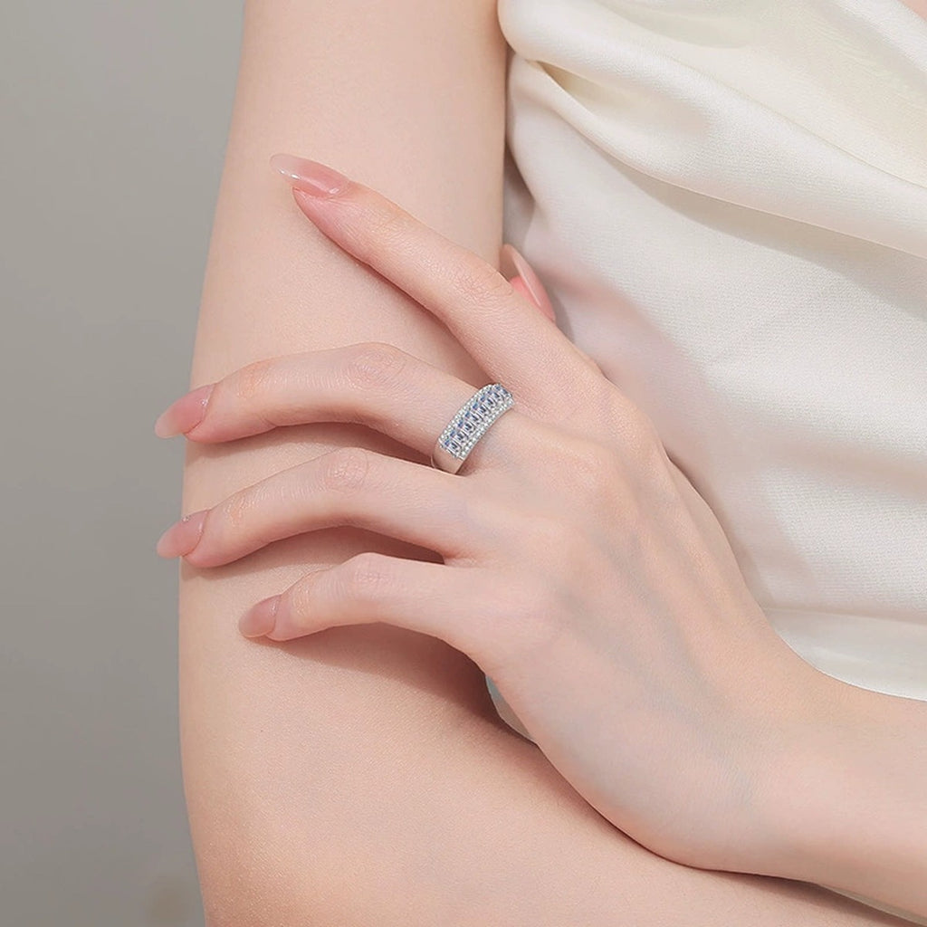 Emerald and Round Moissanite Statement Ring worn on hand to show scale, band width, and ring profile