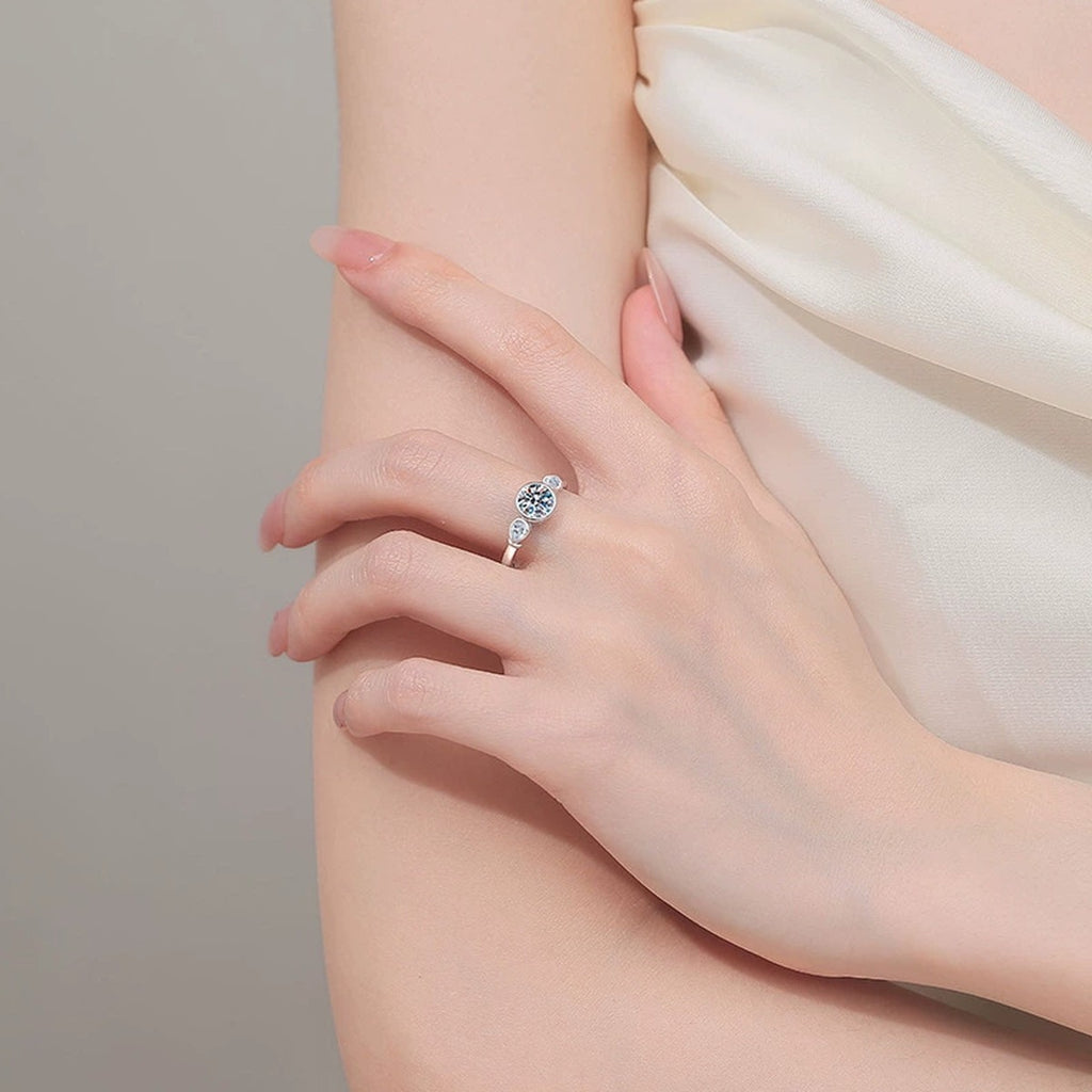 Pear and Round Moissanite Ring worn on hand to show scale, band width, and ring profile