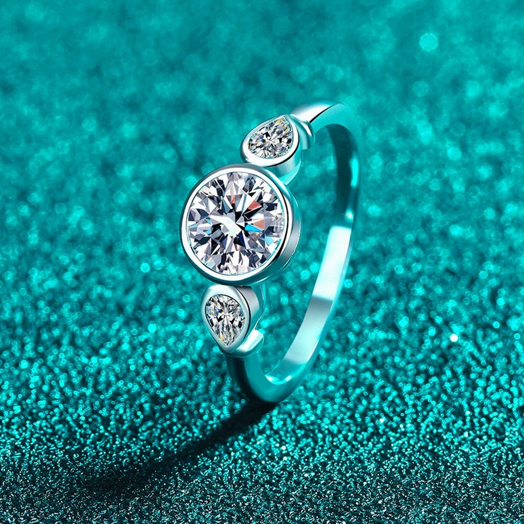 Pear and Round Moissanite Ring product view showing moissanite setting and metal finish