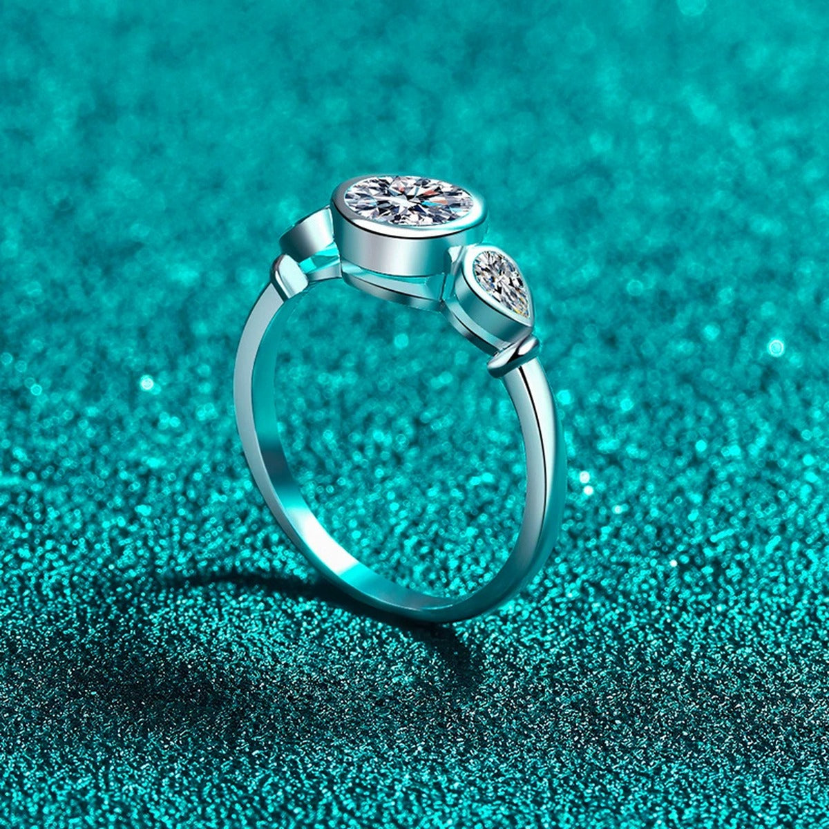 Pear and Round Moissanite Ring product view showing moissanite setting and metal finish
