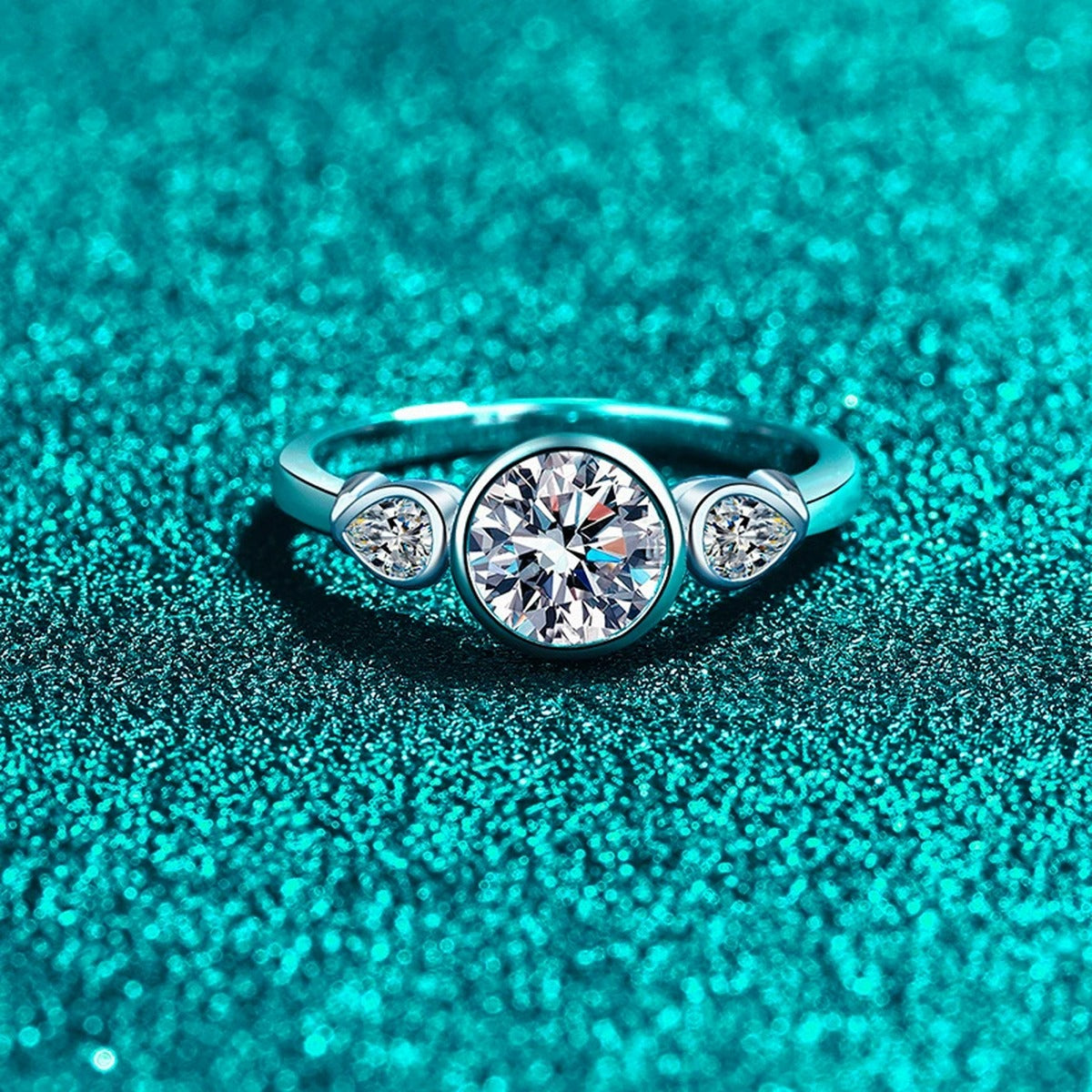 Pear and Round Moissanite Ring product view showing moissanite setting and metal finish