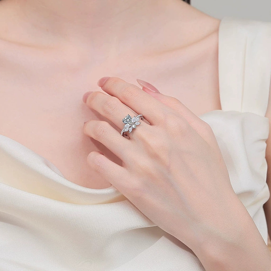 Heart Cut Moissanite Ring with CZ worn on hand to show scale, band width, and ring profile