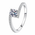 Round Moissanite Ring with CZ in rhodium-plated S925 sterling silver on clean white background
