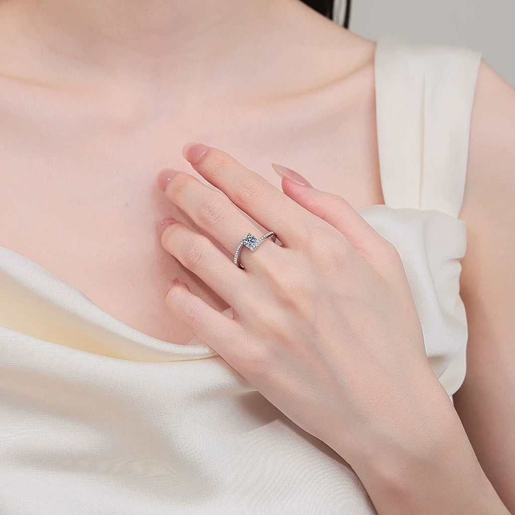 Round Moissanite Ring with CZ worn on hand to show scale, band width, and ring profile