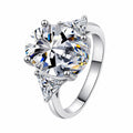 Oval and Radiant Moissanite Statement Ring in rhodium-plated S925 sterling silver on clean white background