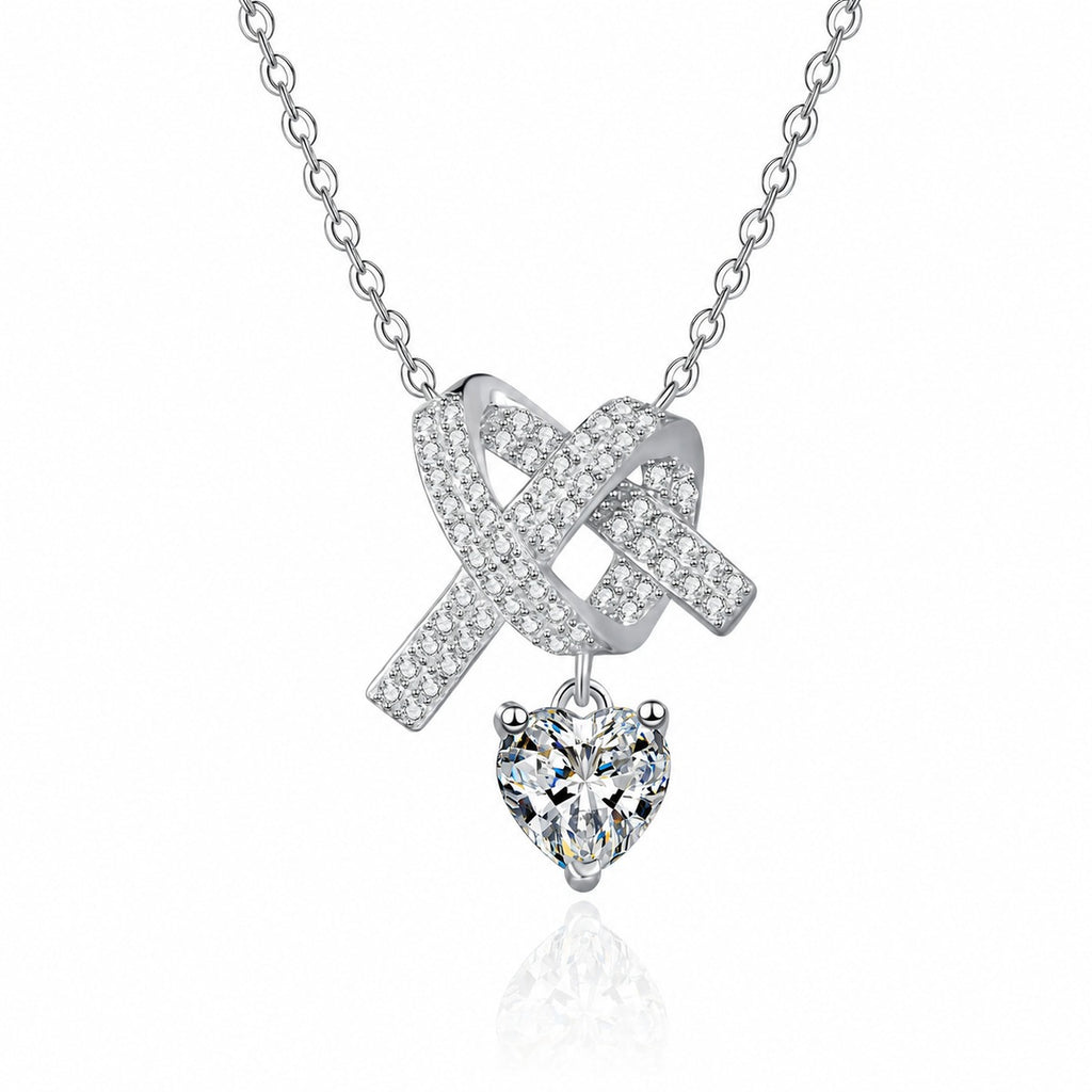Heart Bow Moissanite Pendant Necklace with CZ in Rhodium-Plated S925 sterling silver white background product photo showing bow and heart pendant with a heart cut moissanite drop and CZ ribbon detail