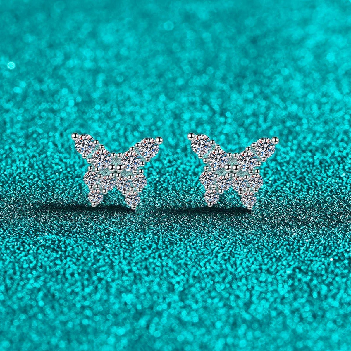 Butterfly Moissanite Stud Earrings in Rhodium-Plated S925 sterling silver product scene view showing angled setting detail