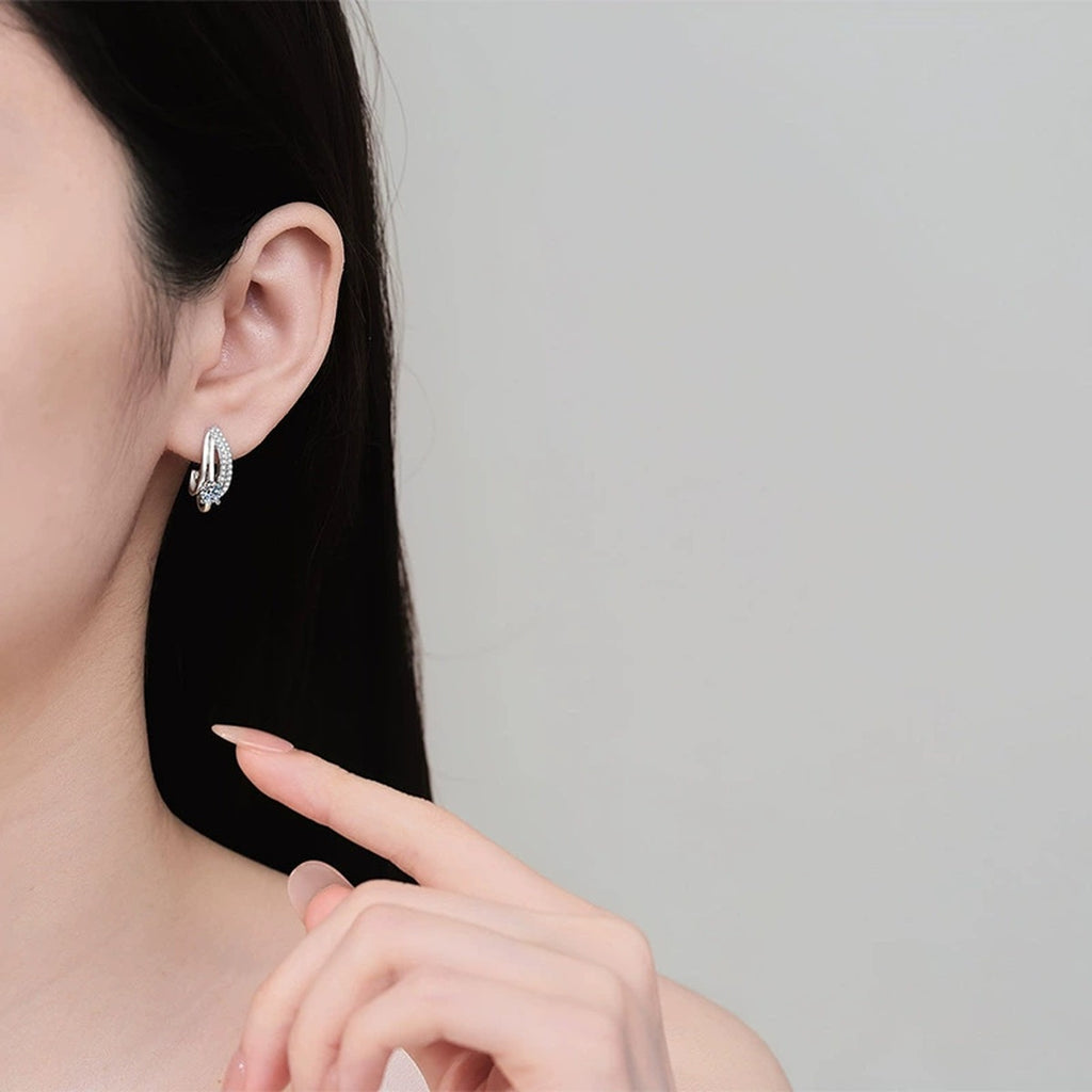Round Moissanite Stud Drop Earrings with CZ in Rhodium-Plated S925 sterling silver worn on ear by model showing scale, placement, and stud earrings styling