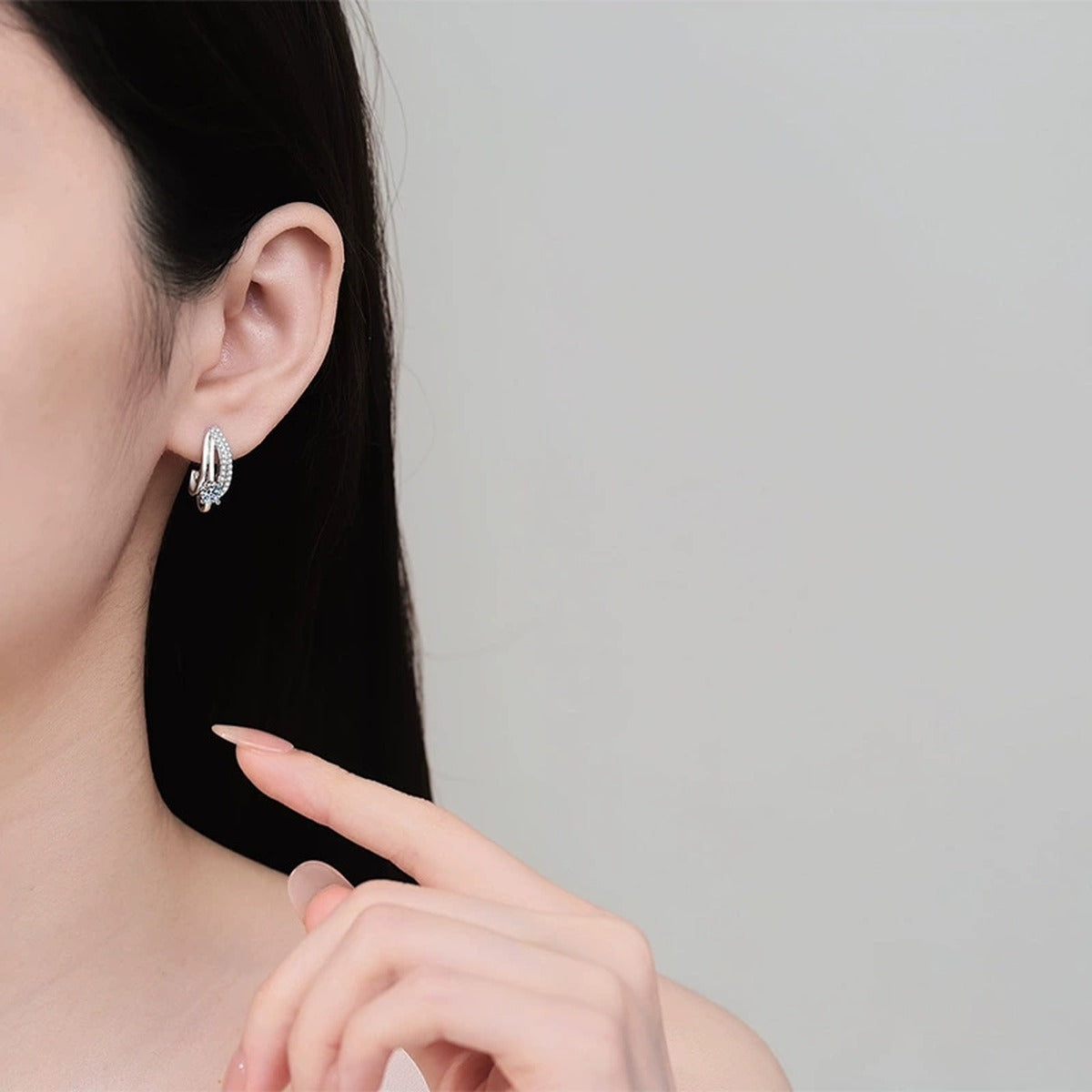 Round Moissanite Stud Drop Earrings with CZ in Rhodium-Plated S925 sterling silver worn on ear by model showing scale, placement, and stud earrings styling