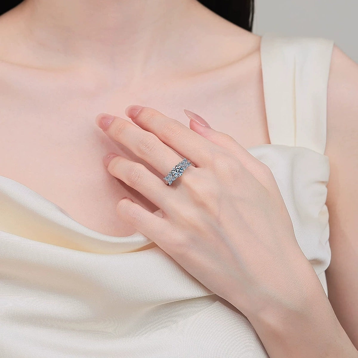 Round Moissanite Ring with CZ worn on hand to show scale, band width, and ring profile