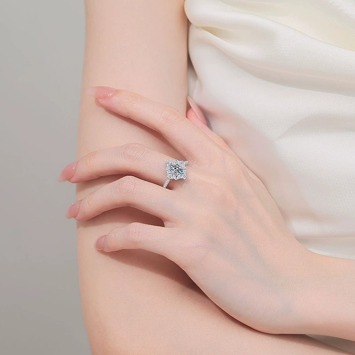 Oval Moissanite Ring with CZ worn on hand to show scale, band width, and ring profile