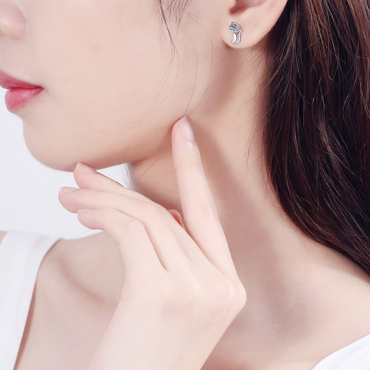 Cat Moissanite Stud Earrings in Rhodium-Plated S925 Sterling Silver worn on ear by model to show scale, drop length, and everyday styling