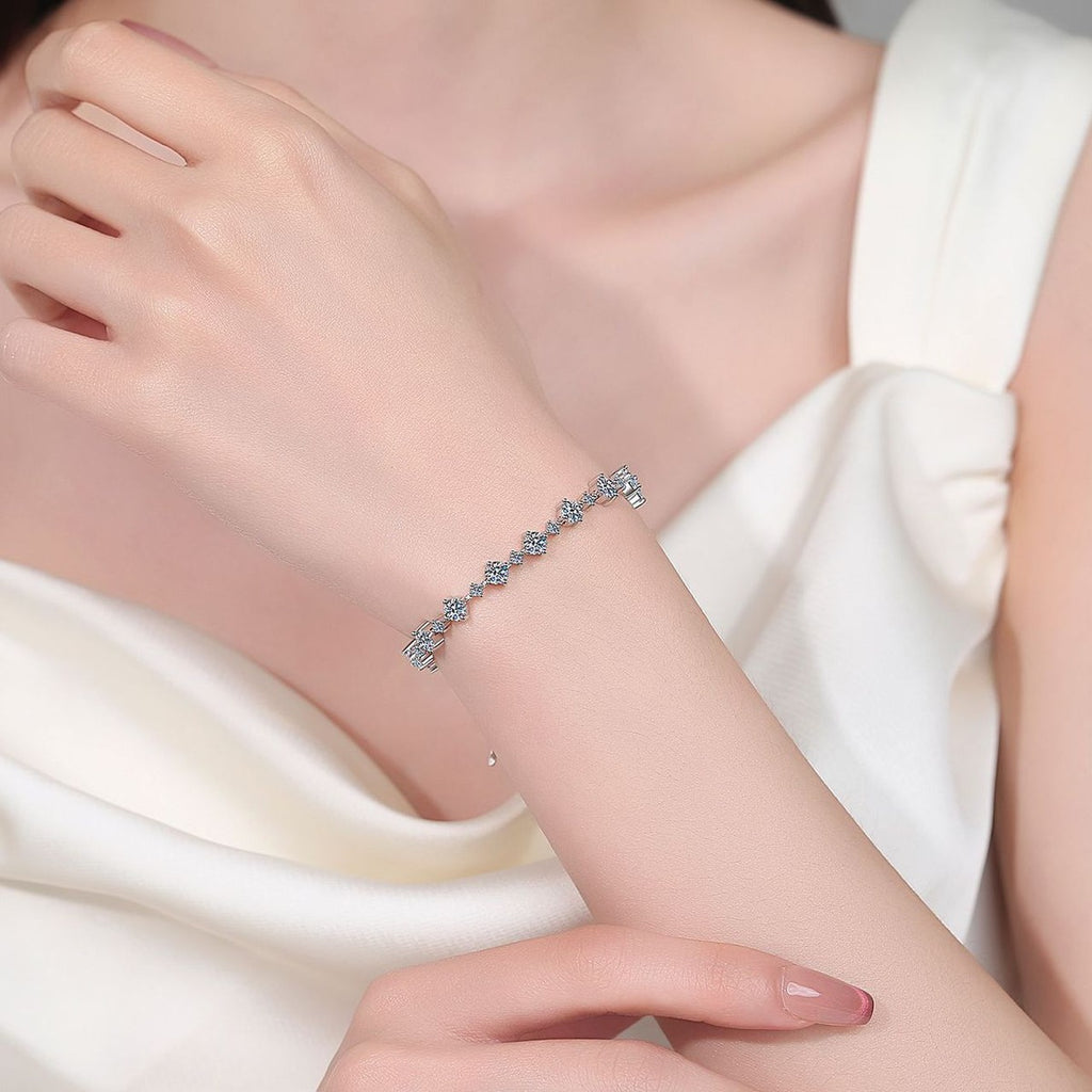 Mixed-Size Round Moissanite Tennis Bracelet in Rhodium-Plated S925 sterling silver worn on wrist model view showing scale and adjustable fit