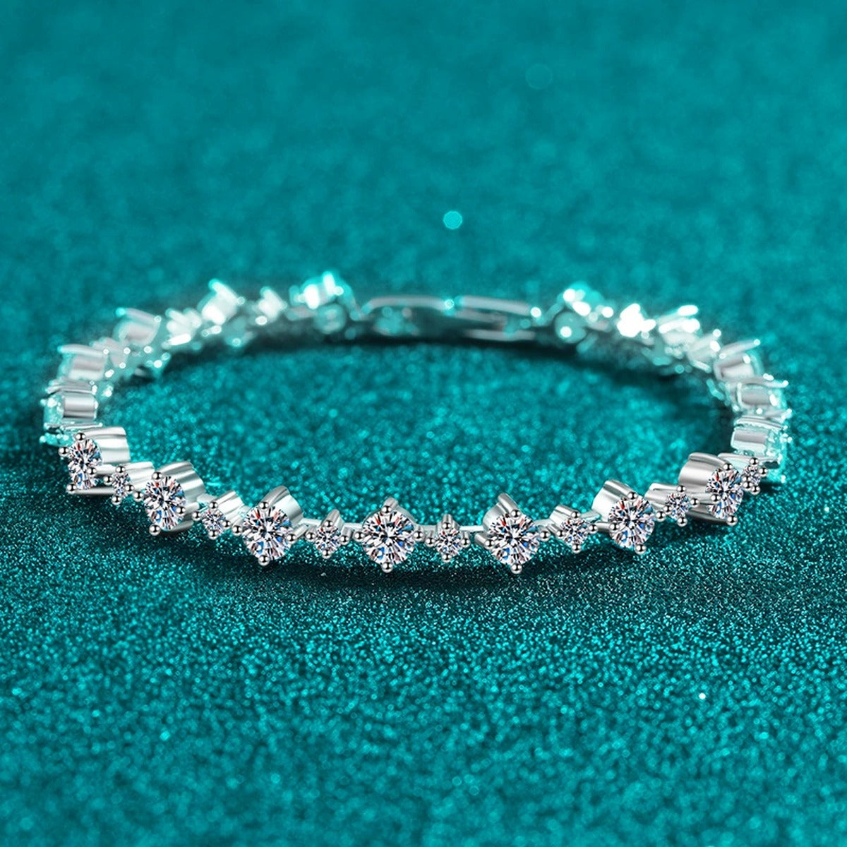 Mixed-Size Round Moissanite Tennis Bracelet in Rhodium-Plated S925 sterling silver styled product scene showing stone sparkle and chain detail