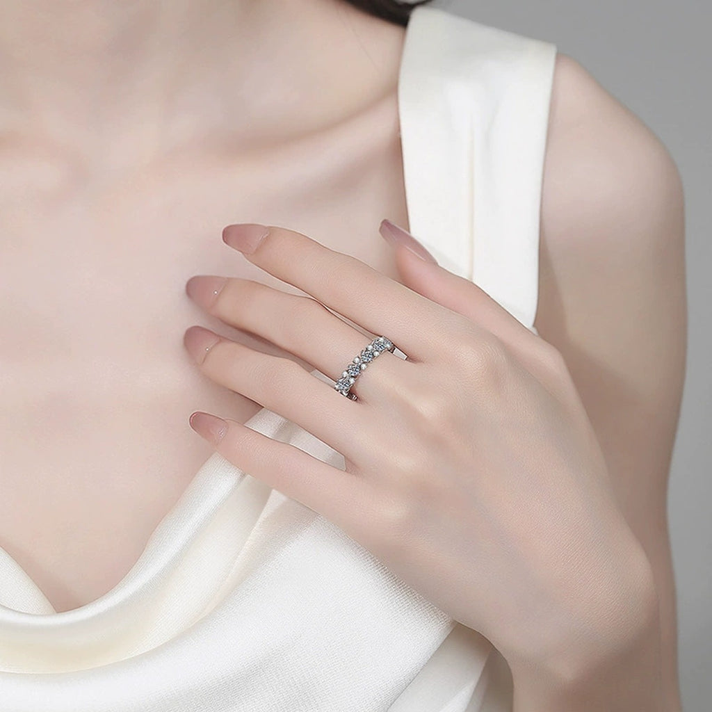 Round Moissanite Eternity Band Ring worn on hand to show scale, band width, and ring profile