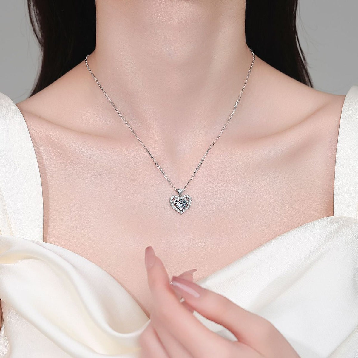 Heart Halo Moissanite Pendant Necklace with CZ in Rhodium-Plated S925 sterling silver neckline model view showing pendant scale and adjustable chain