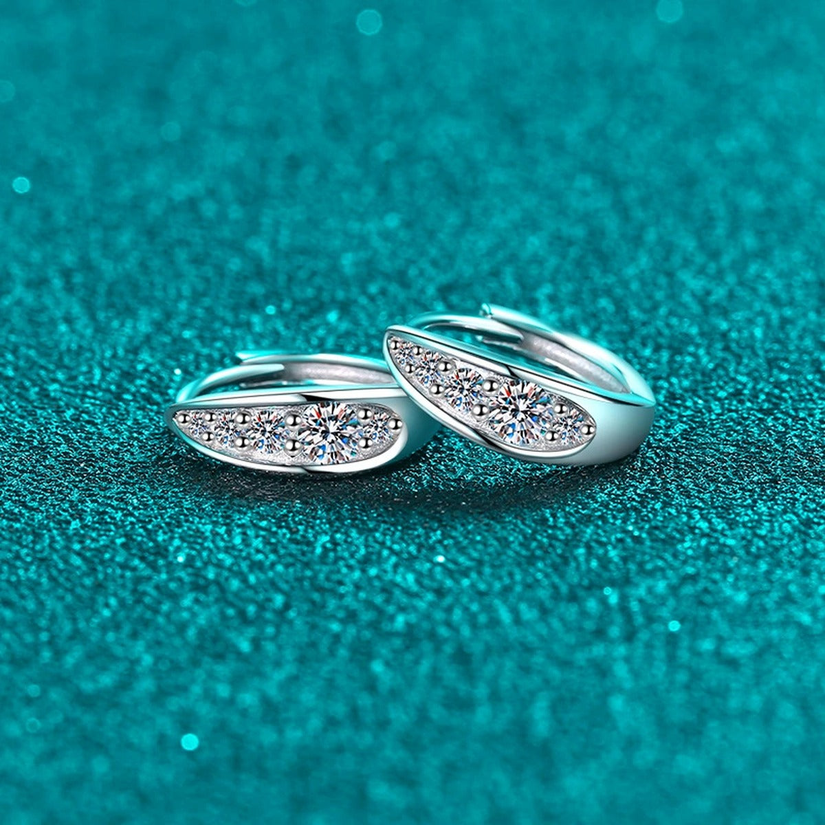 Pave Moissanite Huggie Hoop Earrings in Rhodium-Plated S925 sterling silver product scene view showing angled setting detail