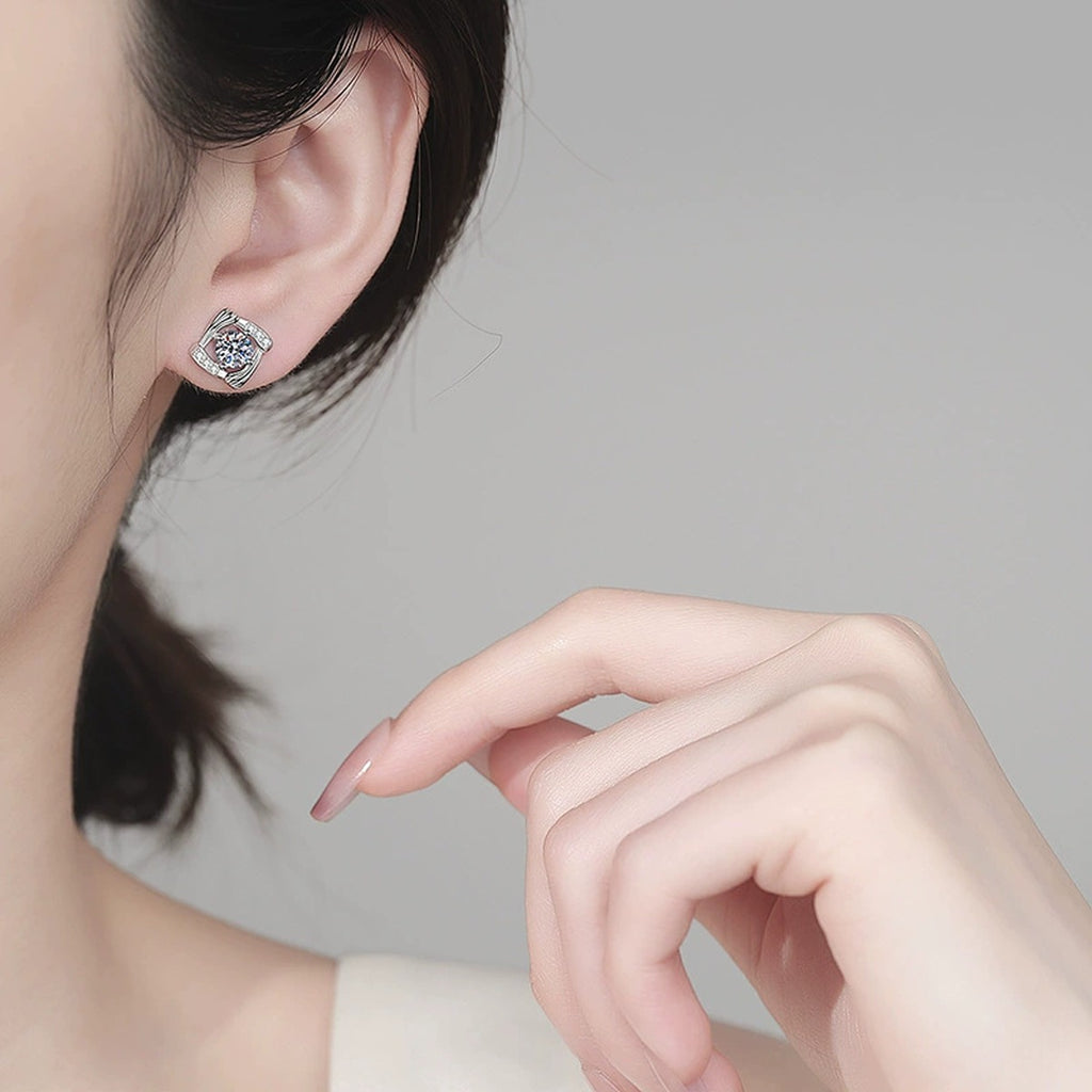 Round Halo Moissanite Stud Earrings with CZ in Rhodium-Plated S925 sterling silver worn on ear by model showing scale, placement, and stud earrings styling