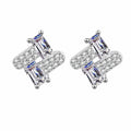 Emerald and Round Moissanite Stud Earrings in Rhodium-Plated S925 sterling silver white background product photo showing the pair, stone shape, and stud earrings silhouette