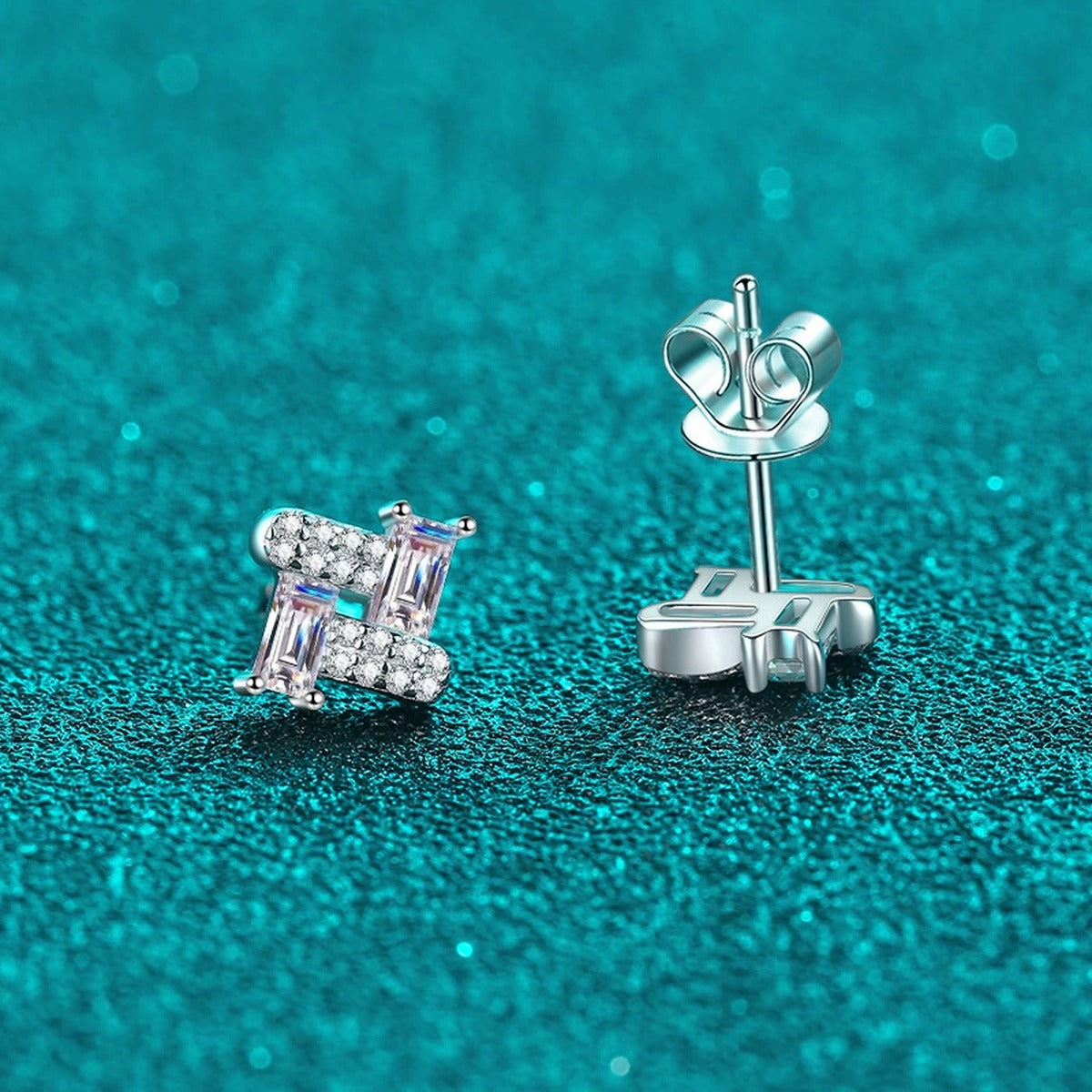 Emerald and Round Moissanite Stud Earrings in Rhodium-Plated S925 sterling silver product scene view showing angled setting detail