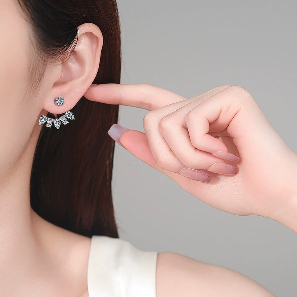 Mixed Cut Moissanite Jacket Stud Earrings in Rhodium-Plated S925 sterling silver worn on ear by model showing scale, placement, and jacket stud earrings styling