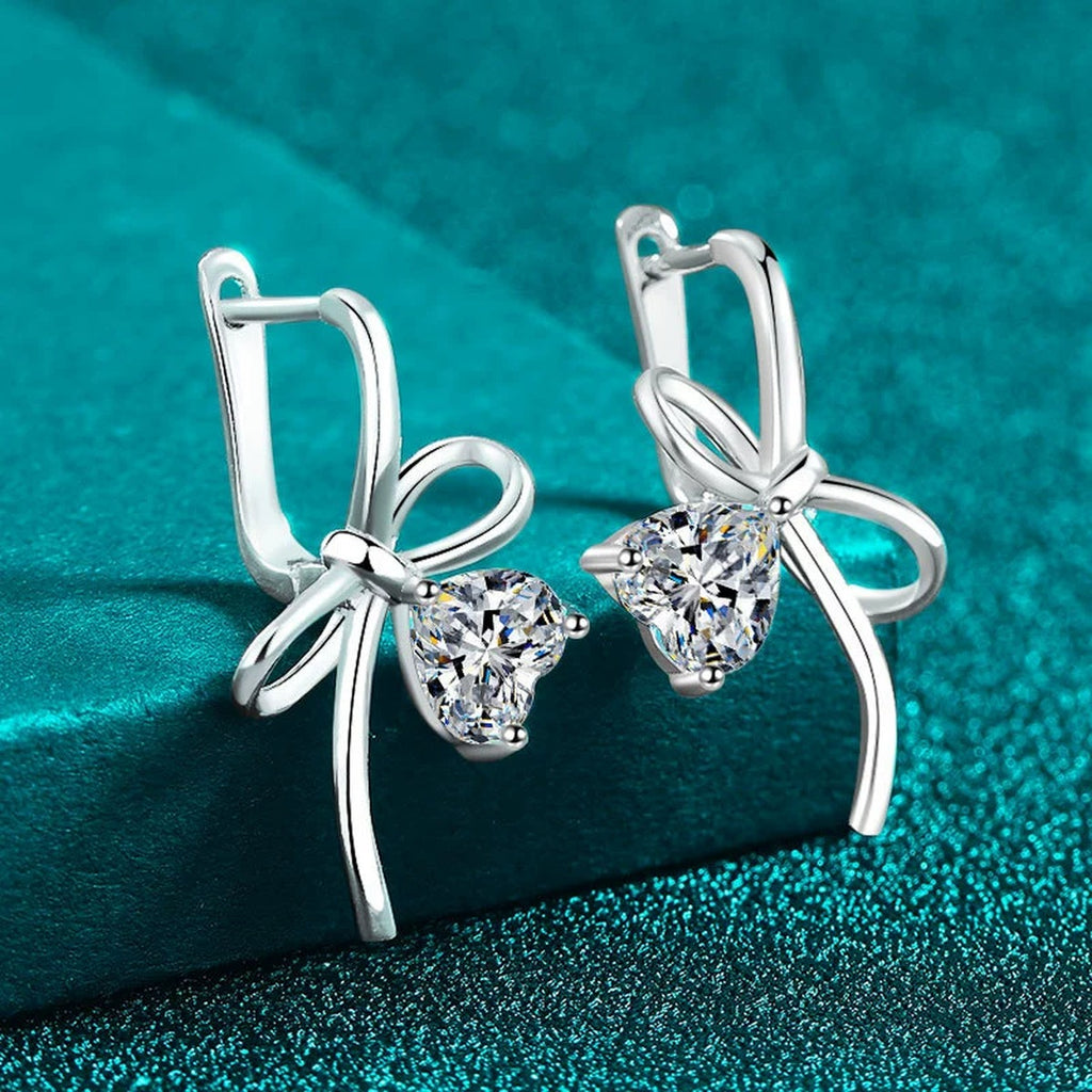 Heart Moissanite Bow Hoop Drop Earrings in Rhodium-Plated S925 sterling silver product scene view showing angled setting detail
