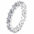Emerald and Round Moissanite Band Ring in rhodium-plated S925 sterling silver on clean white background