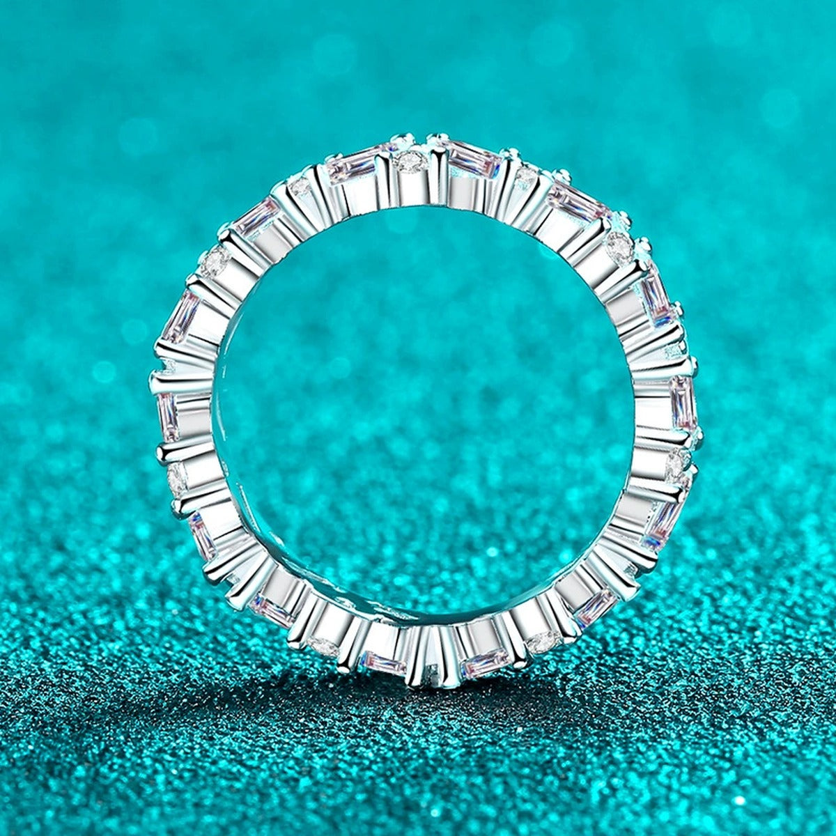 Emerald and Round Moissanite Band Ring product view showing moissanite setting and metal finish